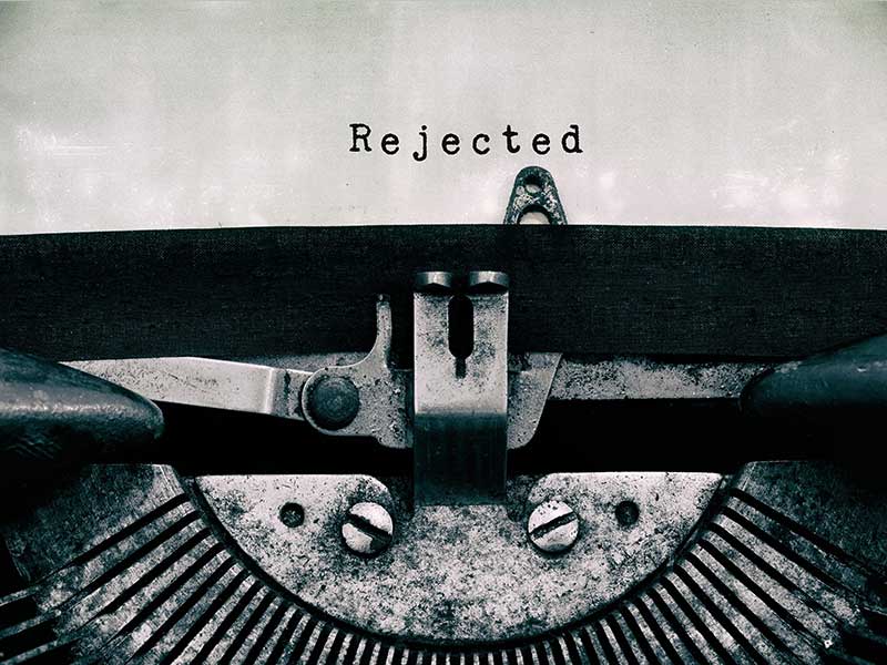 old typewriter and word "rejected"