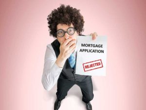 man with rejected mortgage application