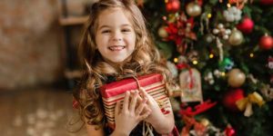 Child with Christmas Present