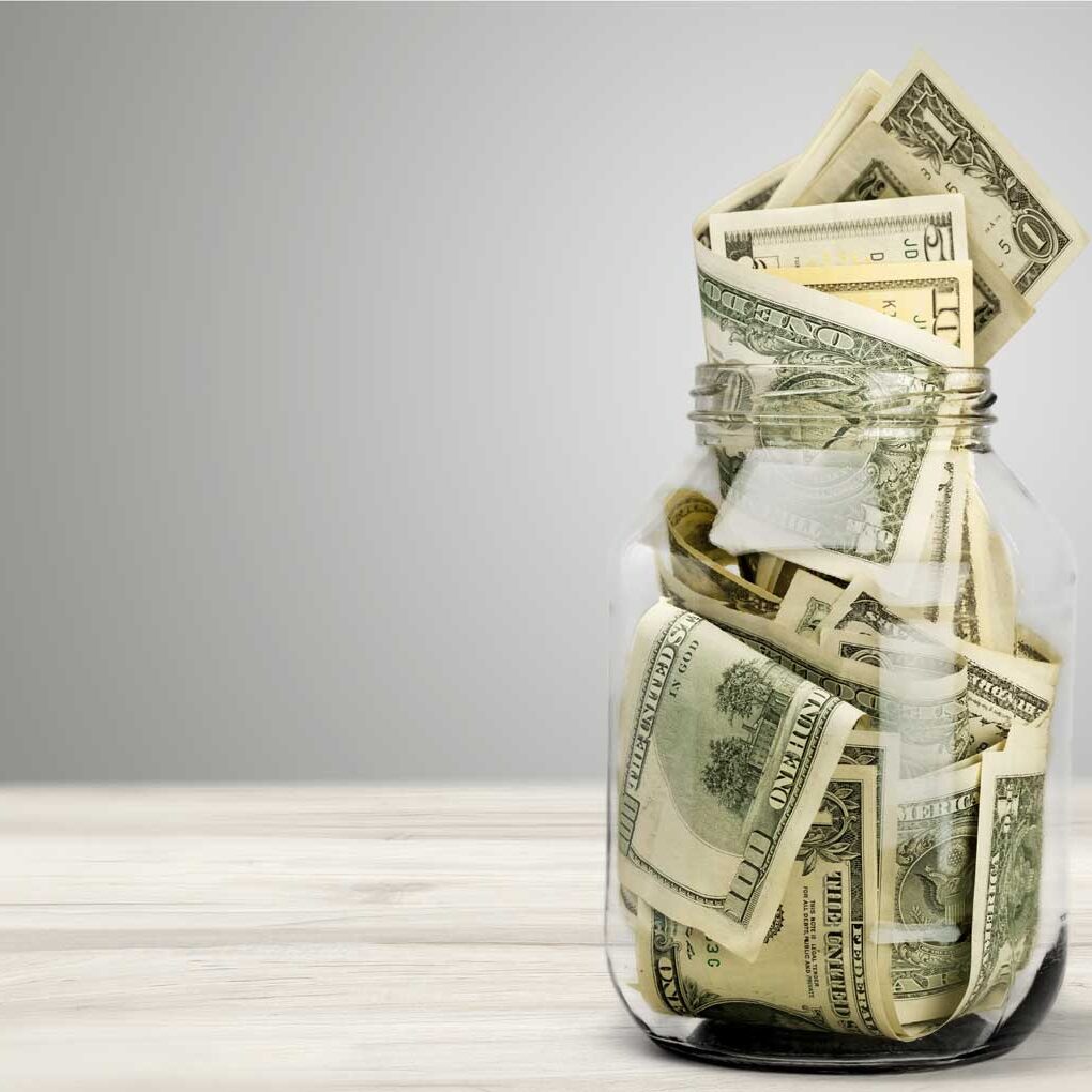 dollar bills in jar